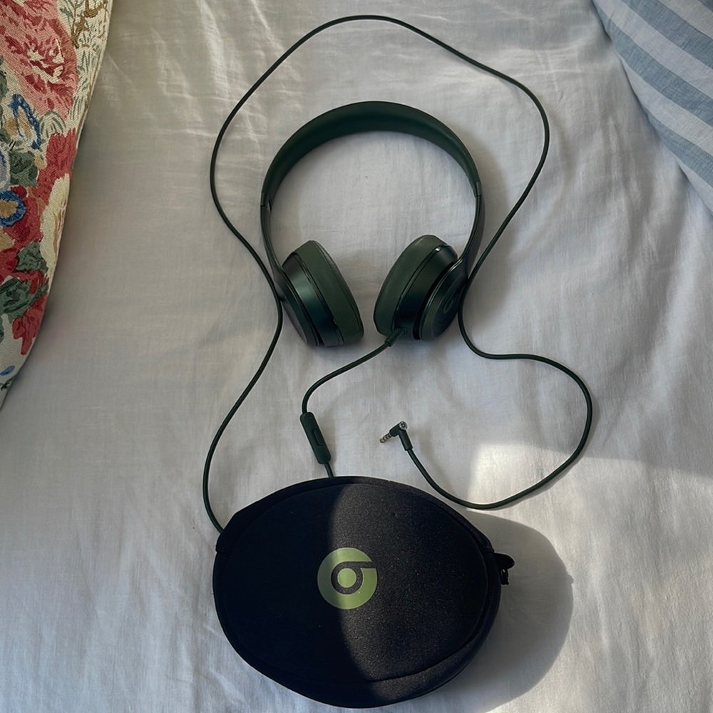 Wired green Beats Solo headphones. Very good used condition. Case included.